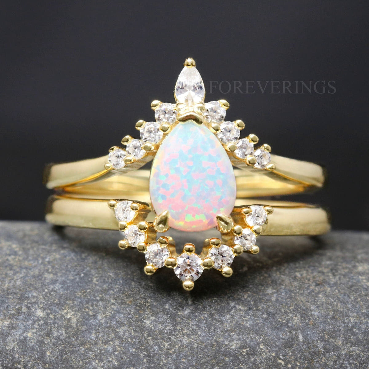 Women's gold sterling silver white fire opal bridal set with crown band, close front view