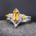 Women's sterling silver bridal set with an elongated hexagon citrine and curved band, straight on
