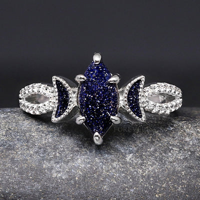 Women's sterling silver marquise blue sandstone ring with crescent moon accents, straight on