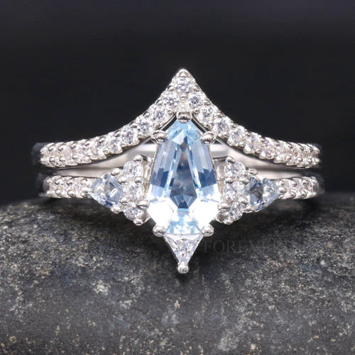 Women's sterling silver shield-cut aquamarine bridal set with chevron band, close front view