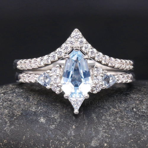 Women's sterling silver shield-cut aquamarine bridal set with chevron band, close front view