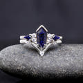 Sterling silver coffin-cut blue sandstone engagement ring with a chevron band, straight on