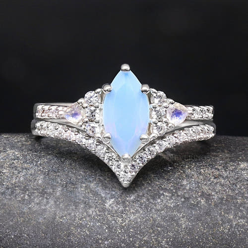 Women's sterling silver bridal set with a marquise opalescent sapphire and moonstone accents, close-up straight on