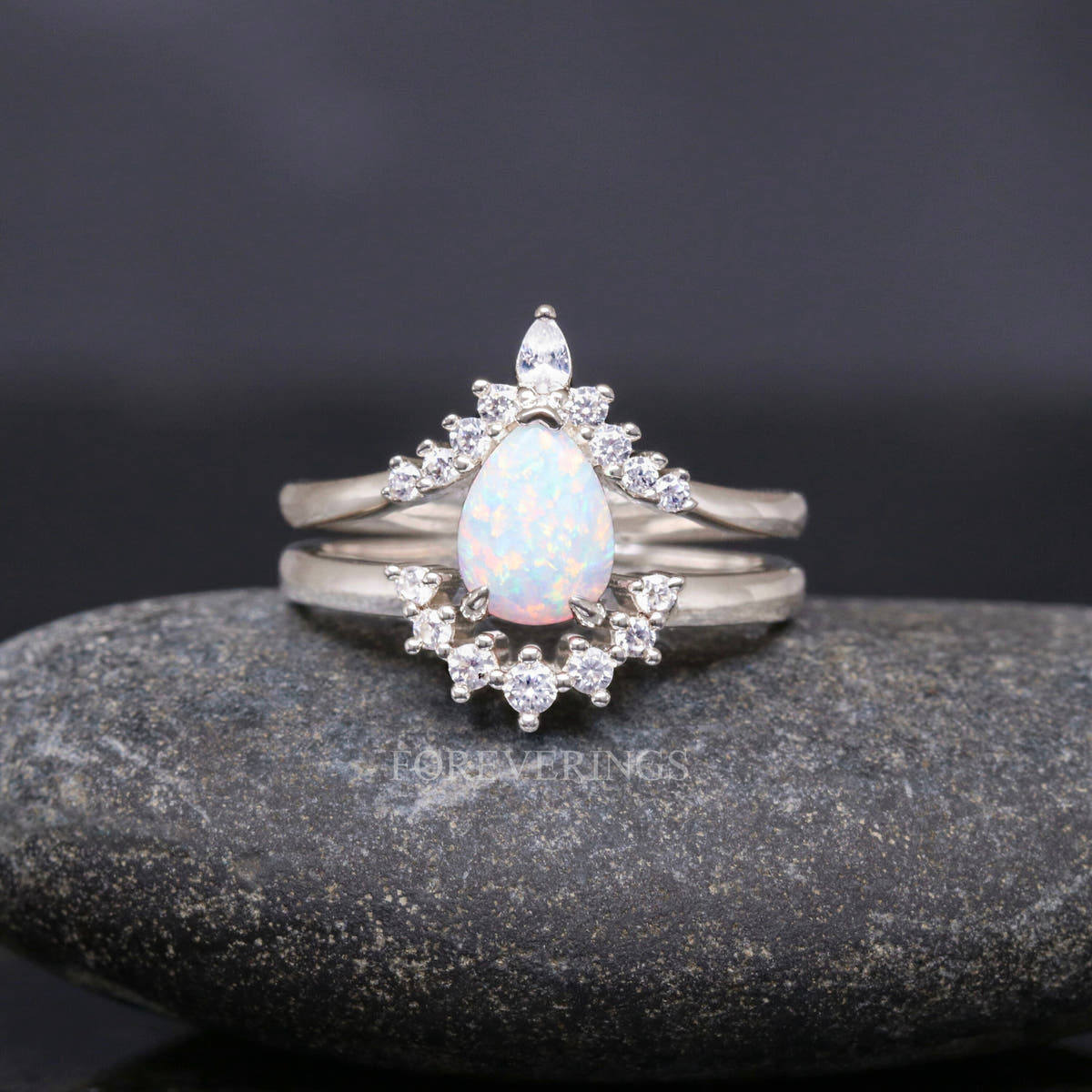Sterling silver white fire opal bridal set shown straight on in a wider view