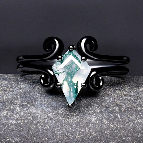 Women's black sterling silver kite cut moss agate ring with swirl details, close-up