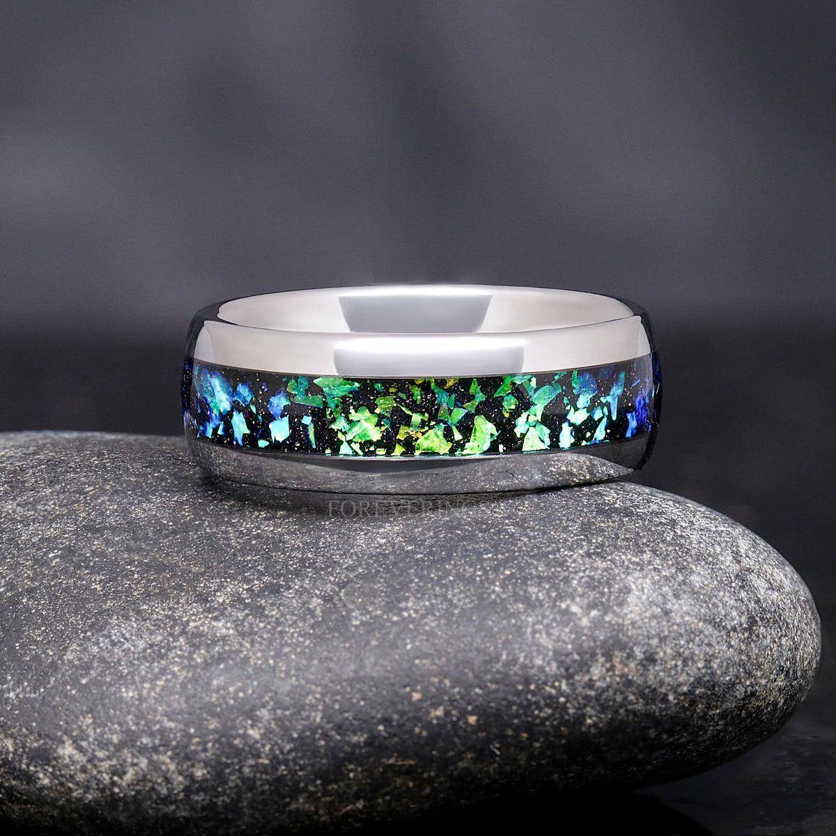 Men's 8mm silver tungsten wedding band with green and blue Rosette nebula inlay, standing upright