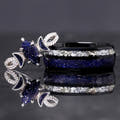 Matching couples ring set with a silver blue sandstone marquise ring and 8mm black tungsten band