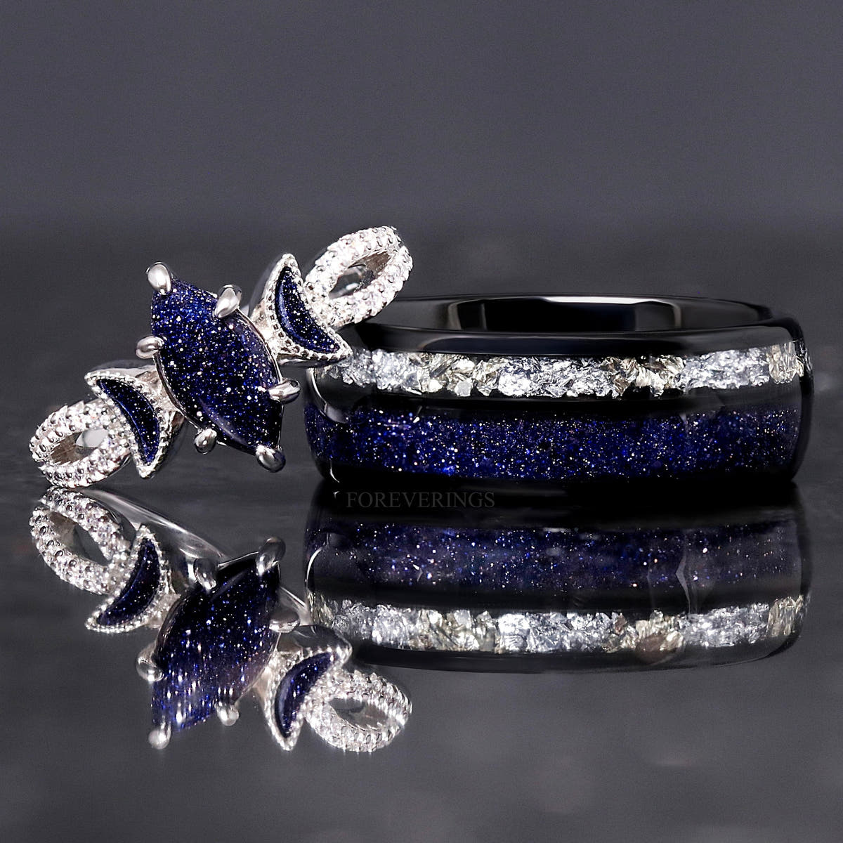 Matching couples ring set with a silver blue sandstone marquise ring and 8mm black tungsten band