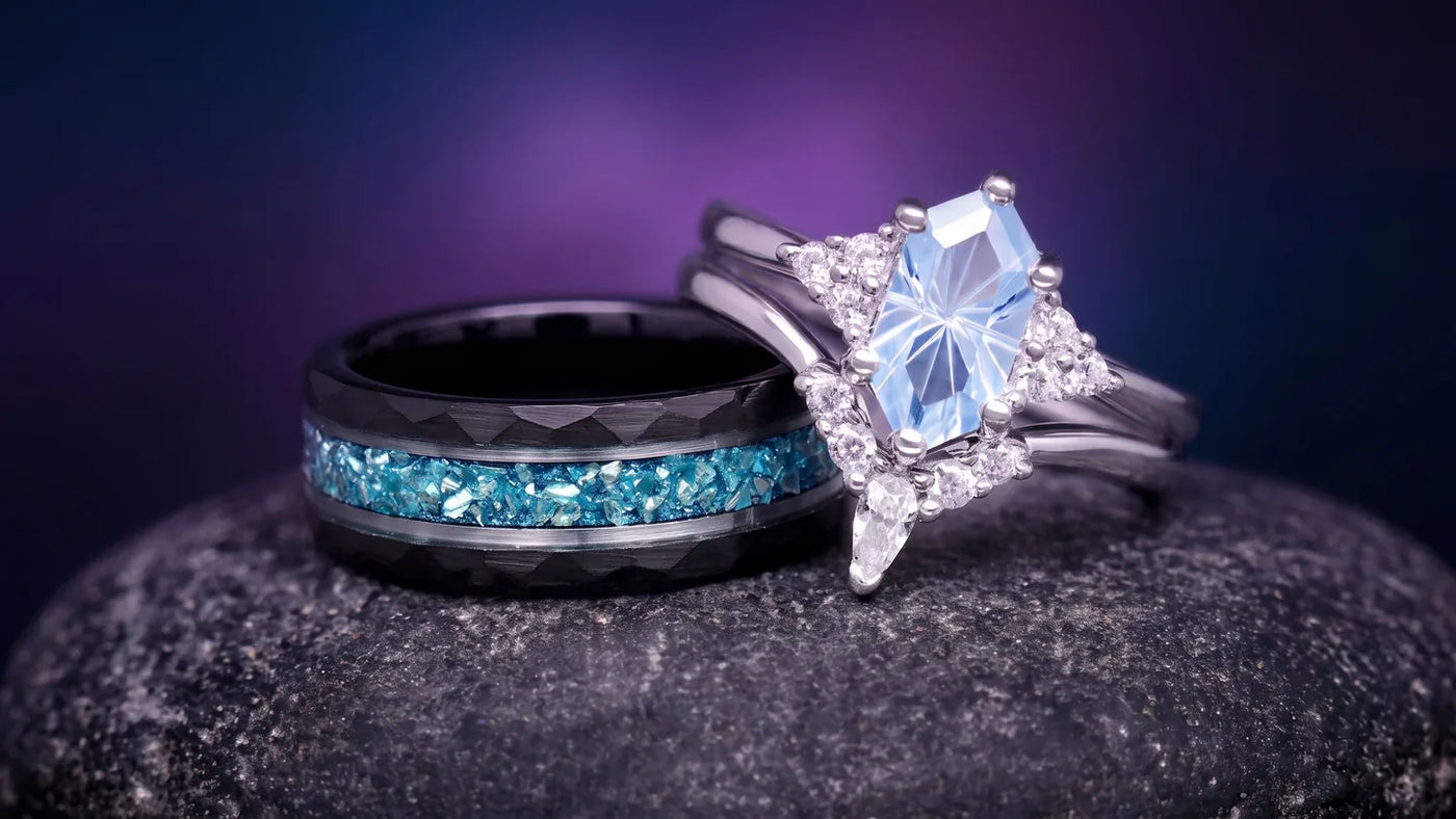 Matching engagement ring set: her sterling silver ring beside his tungsten band