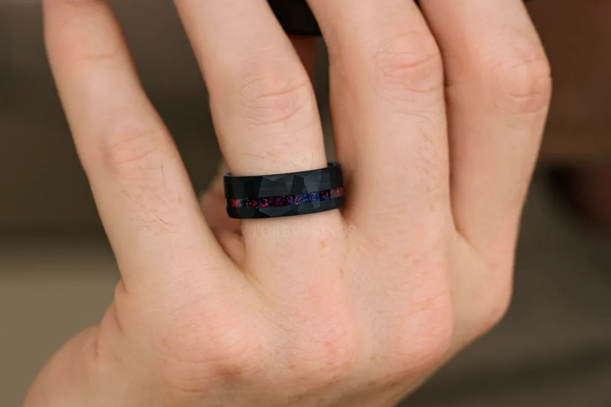 Men's black opal ring in hammered black tungsten on hand