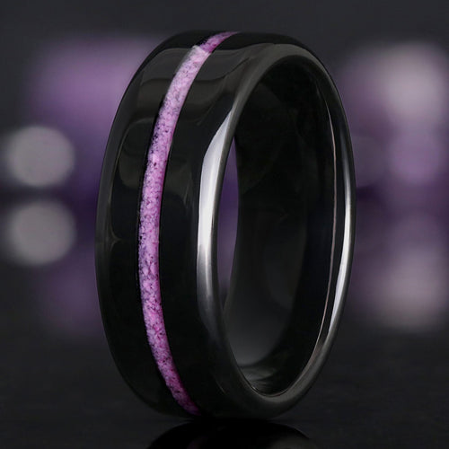 Men's 8mm black tungsten wedding band with a crushed purple turquoise inlay, standing at an angle