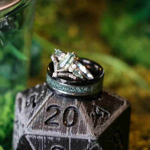 Matching moss agate couples ring set, the kite cut engagement ring stacked on an 8mm black tungsten band