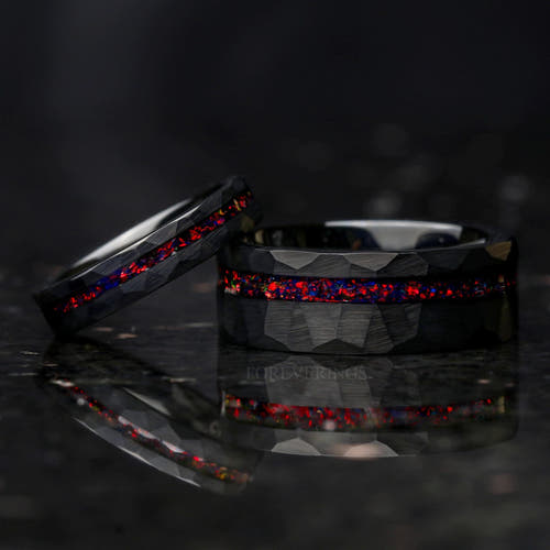 Matching hammered black tungsten couples ring set with black fire opal inlays, her 4mm band offset, 8mm and 4mm