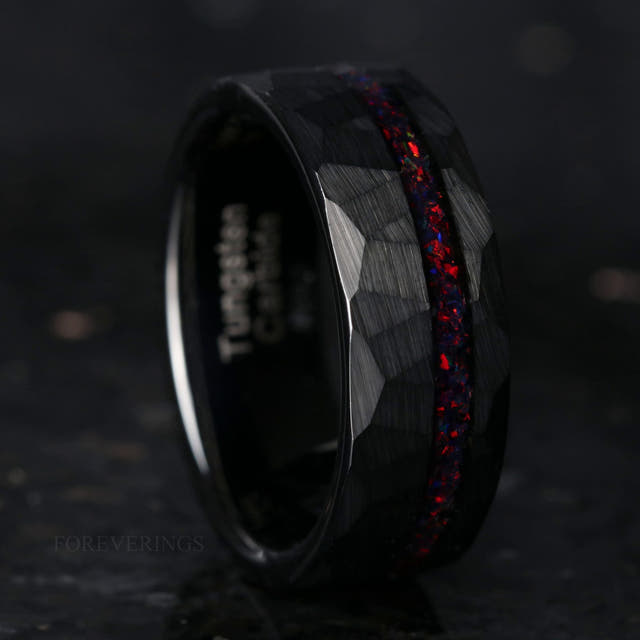 8mm hammered black tungsten ring with a black fire opal stripe, standing upright
