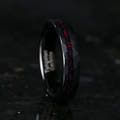 Offset black fire opal ring in hammered black tungsten, wider side view