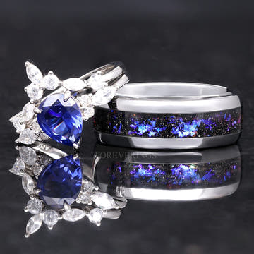 Matching couples ring set: sapphire bridal set leaning on a wider silver band with nebula inlay