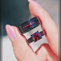 His and hers black engagement ring set with fire opal and garnet