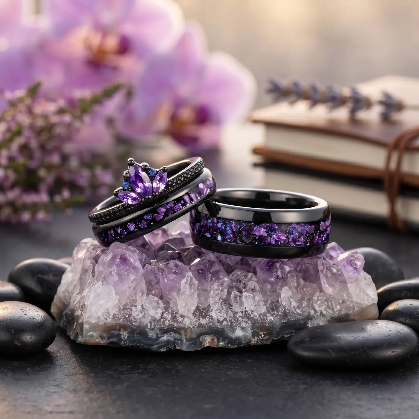 Black couples rings with purple amethyst inlay displayed on an amethyst crystal cluster