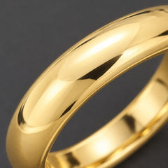 Close-up of a polished yellow gold wedding band