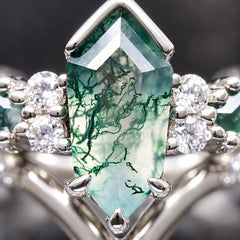 Close-up of the coffin kite-cut moss agate stone in a sterling silver engagement ring