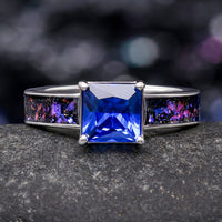 Women's sterling silver engagement ring with a princess cut blue sapphire and Orion nebula inlay, front view