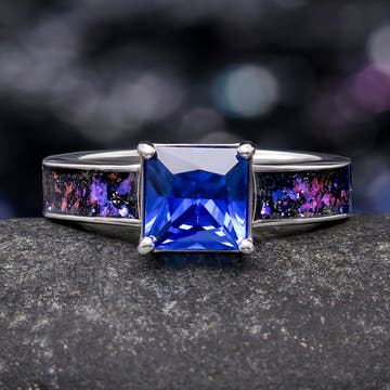 Women's sterling silver engagement ring with a princess cut blue sapphire and Orion nebula inlay, front view