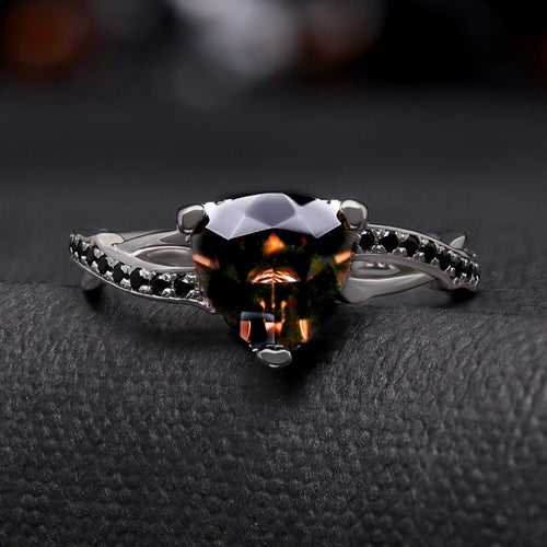 Women's smoky quartz engagement ring on a twisted sterling silver branch band with black accent stones