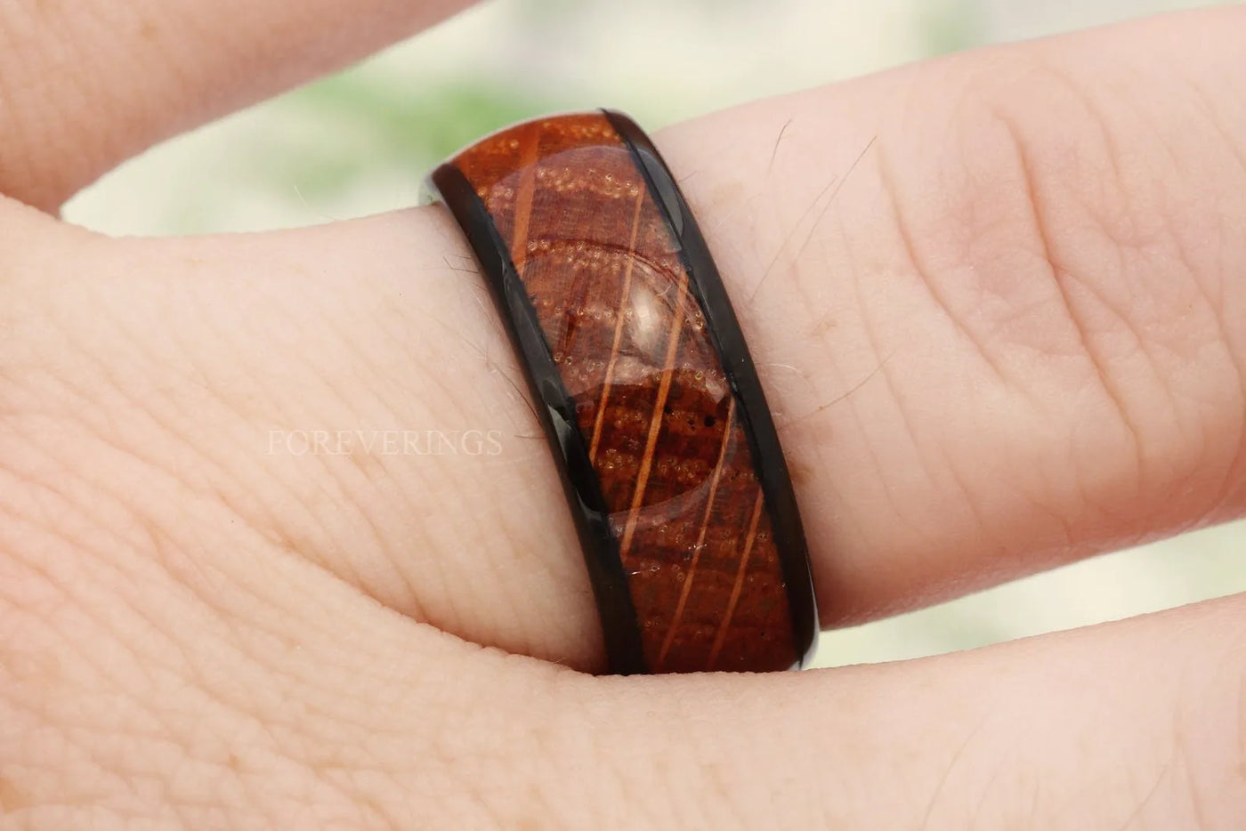 Whiskey barrel ring with real barrel wood inlay worn on his hand