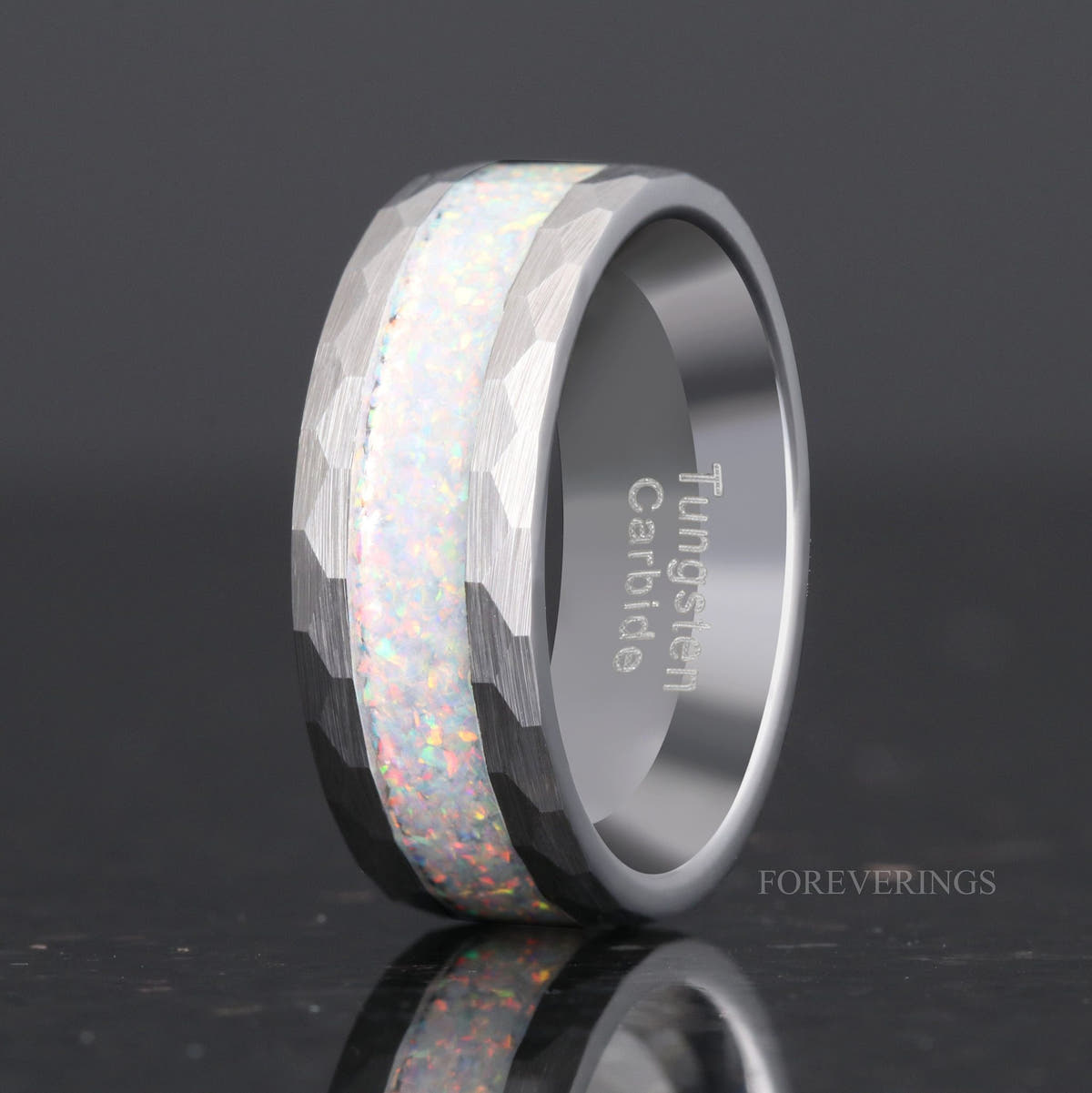 Men's 8mm hammered silver tungsten ring with white fire opal inlay, standing at an angle